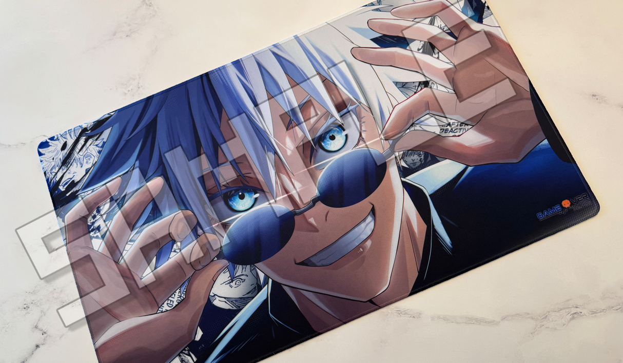 A rectangular gaming mouse pad featuring an anime illustration of Satoru Gojo from Jujutsu Kaisen, shown resting on a light marble surface. The design includes his signature blue hair, sunglasses, and a wide grin.