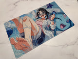 Illustrated mouse pad with a character holding a smartphone on a marble surface